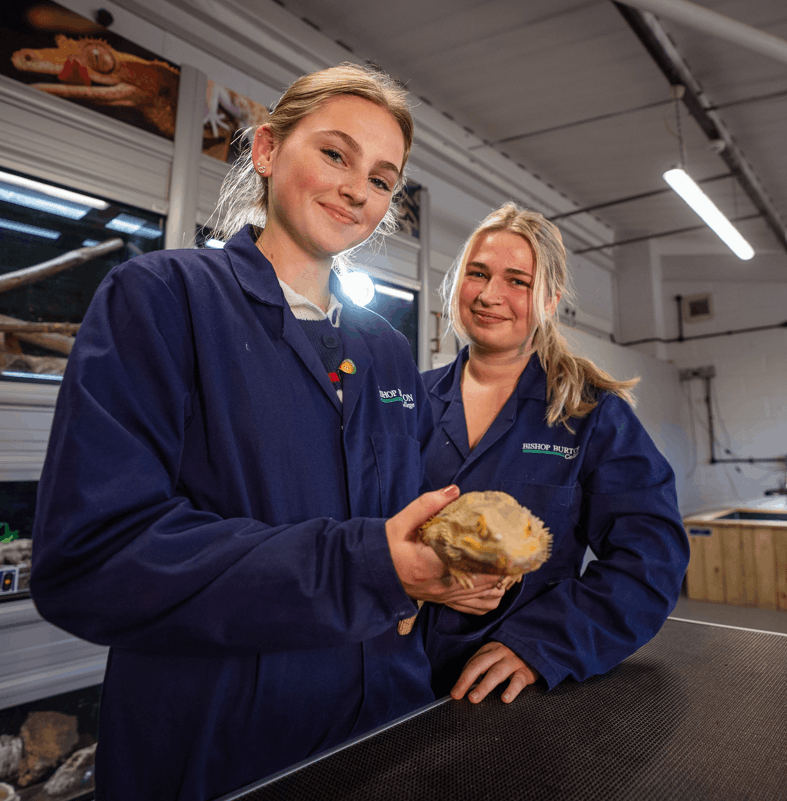 Bishop Burton HE students holding a dragon
