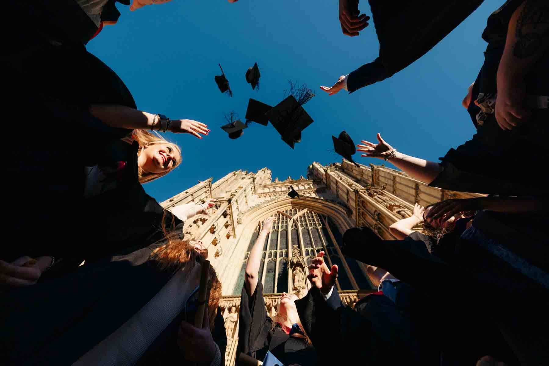 Student success graduation University Centre Bishop Burton graduates throw caps into the sky