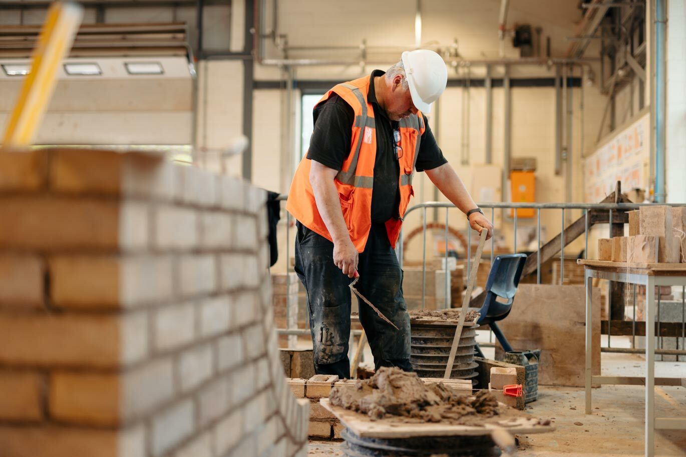 Adult learner on bricklaying course