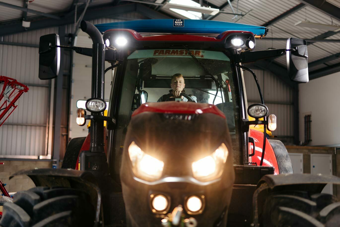 Agri gallery Student in tractor with lights on