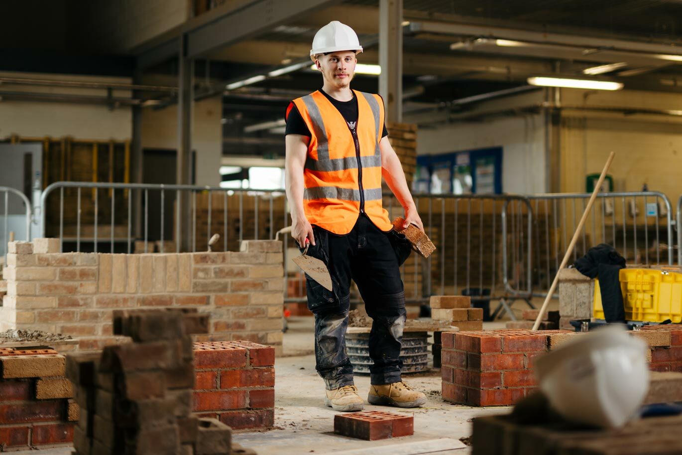 Bricklaying student in construction workshop