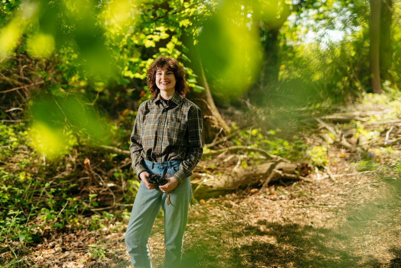 Country gallery Ecology student with binoculars to observe wildlife