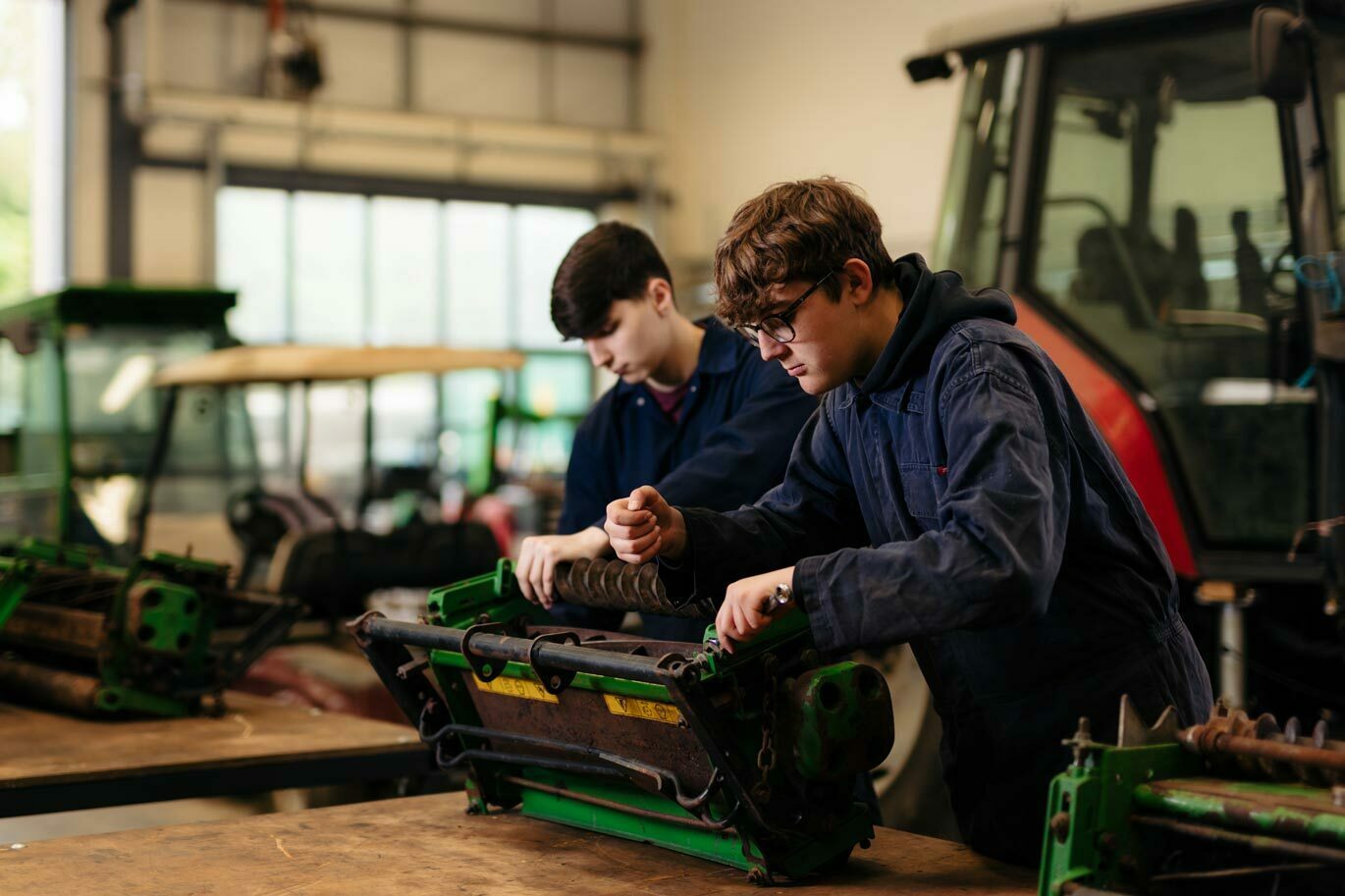 Engin gallery Students working on machinery in Engineering workshop