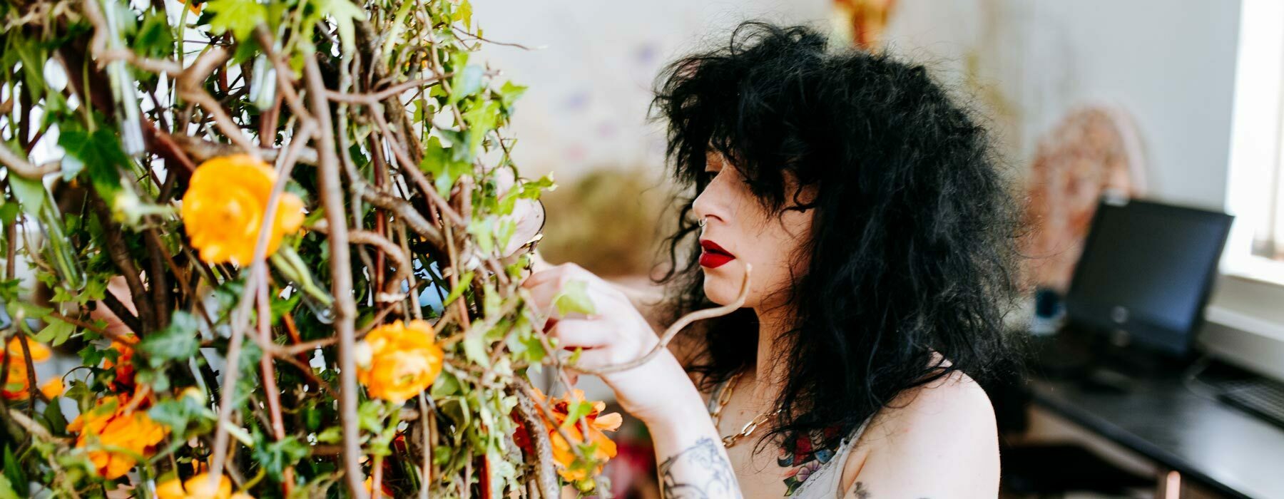 Floristry banner Degree student working on large floral display