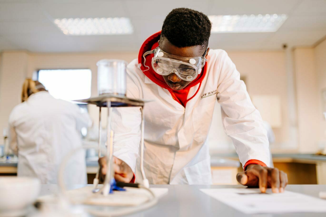 Forensic callout Science student lighting bunsen burner