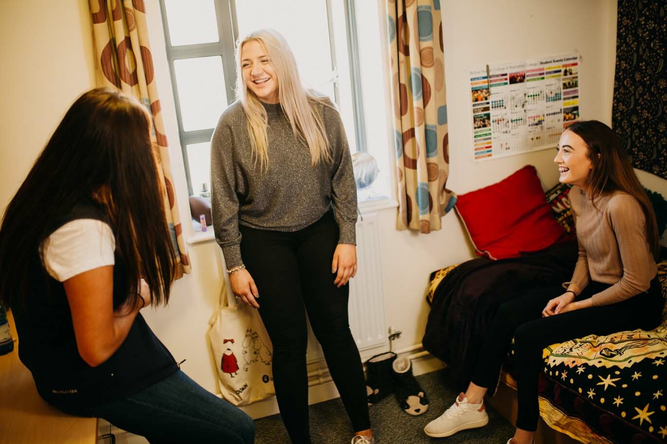 Girls laughing in student room