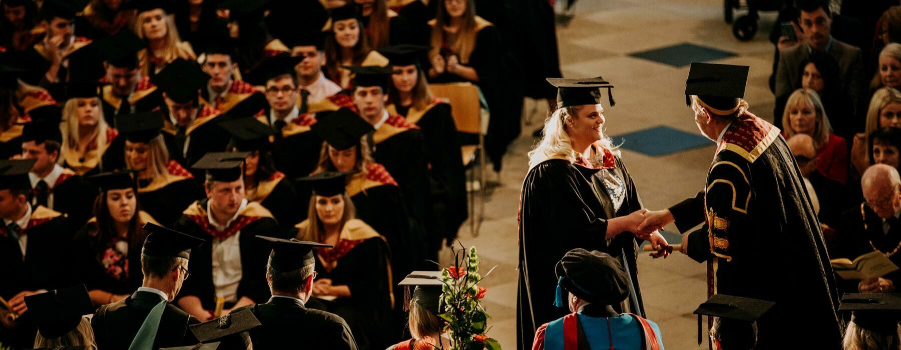 Graduate on stage at Beverley Minster
