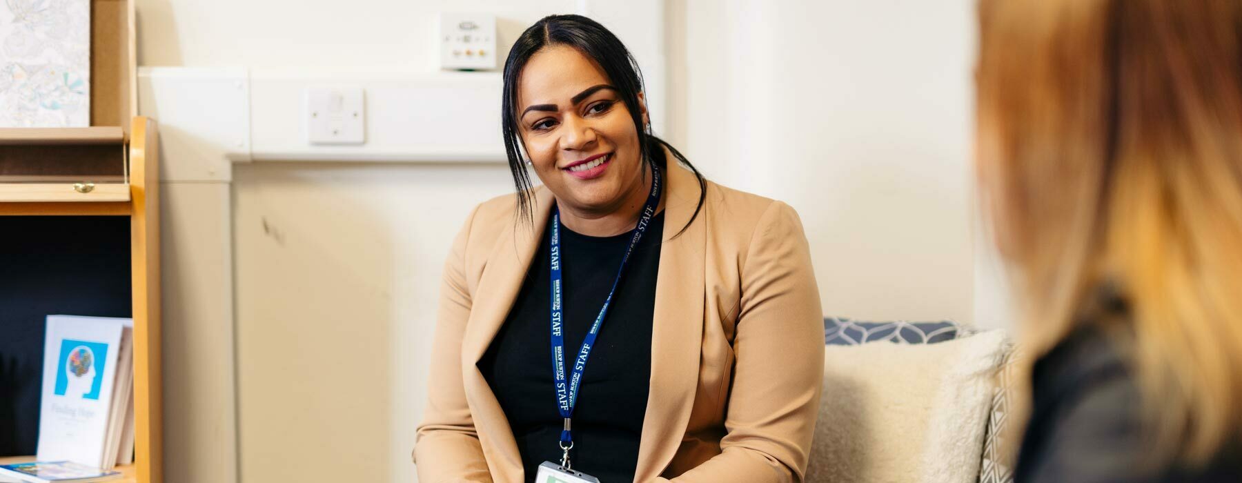 Health and Wellbeing Officer helping student