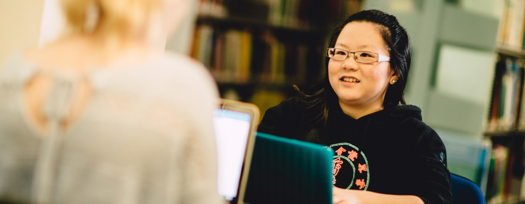 International banner Student studying at laptop in Learning Resource Centre
