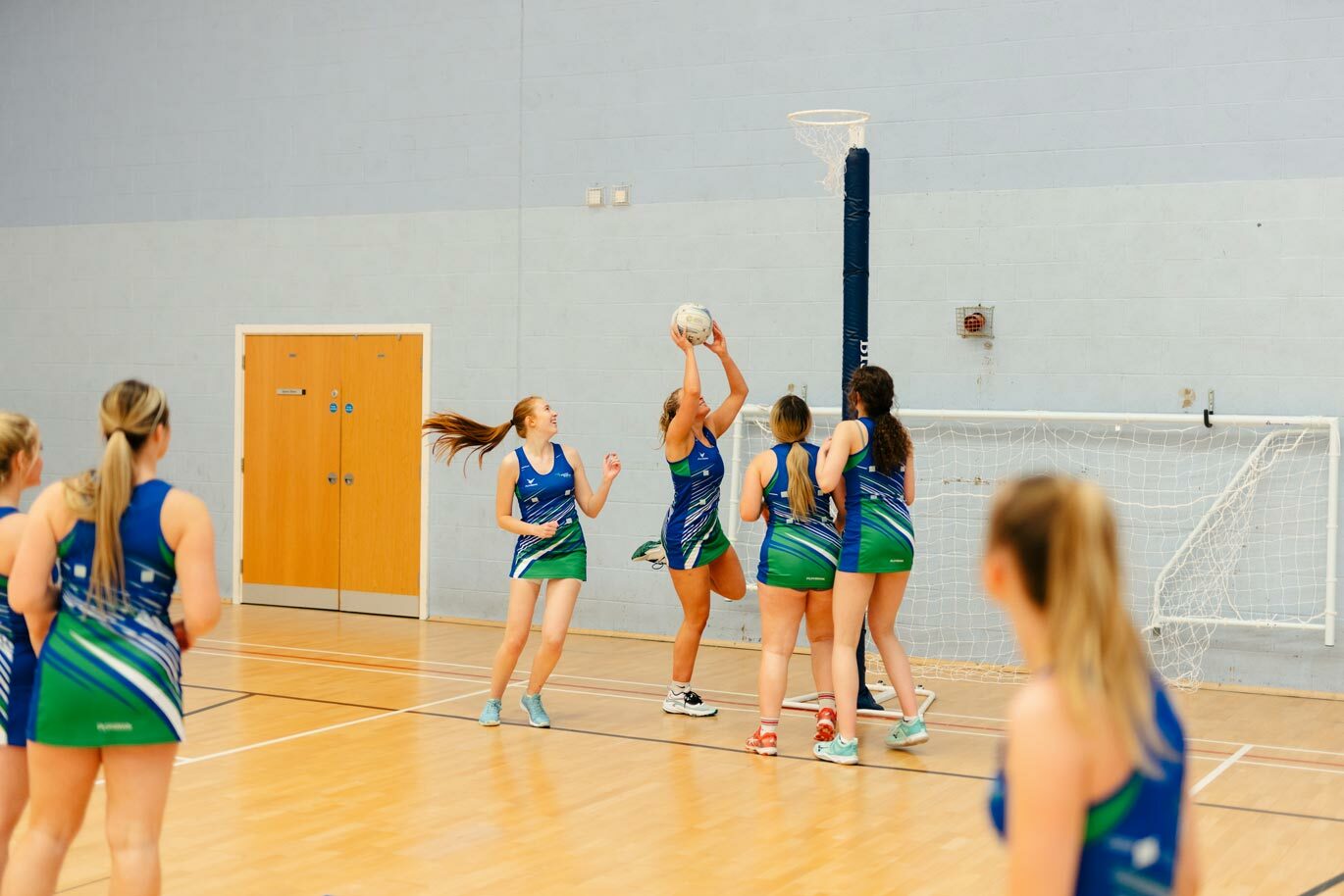 Netball training in sports hall