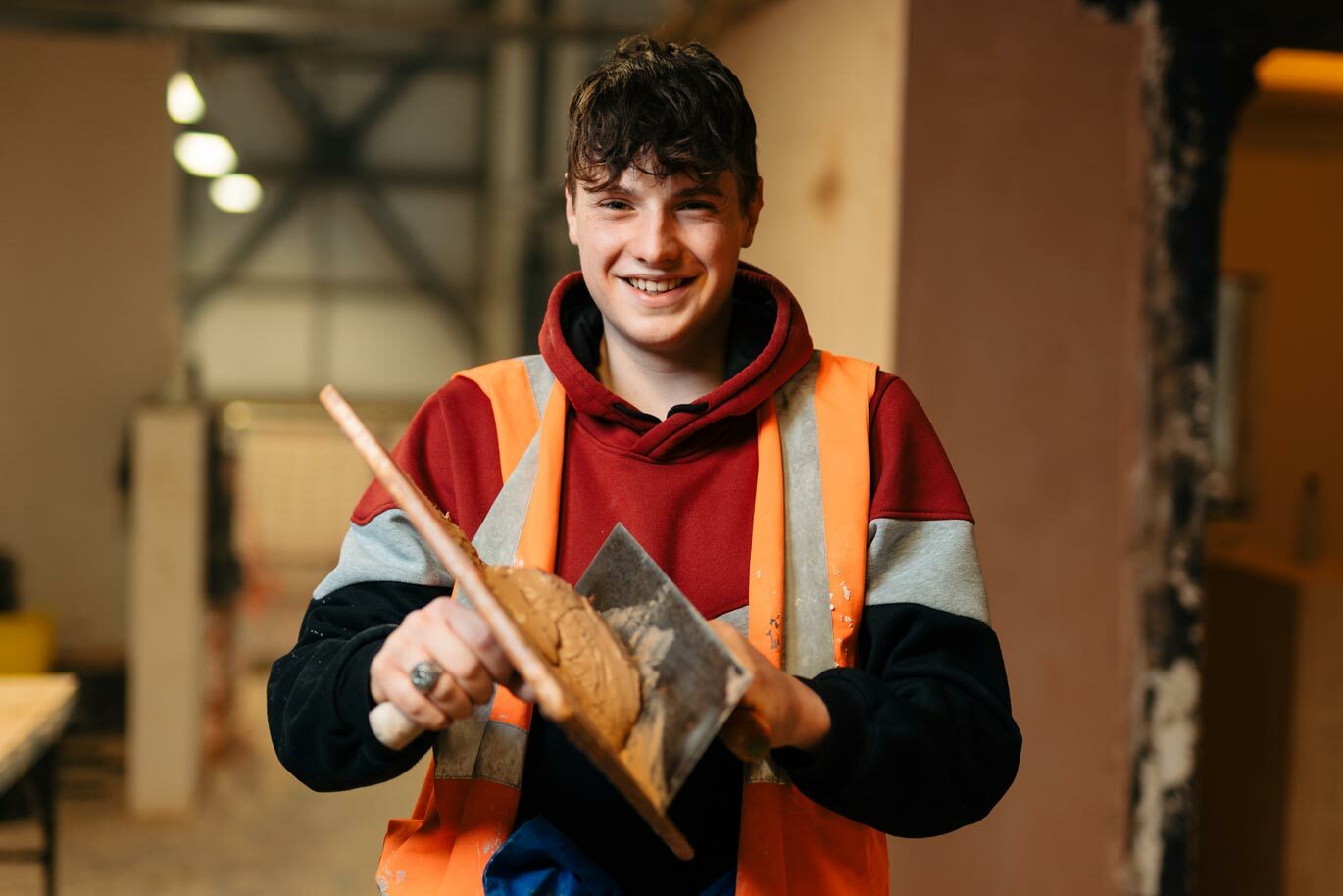 Plastering student in workshop