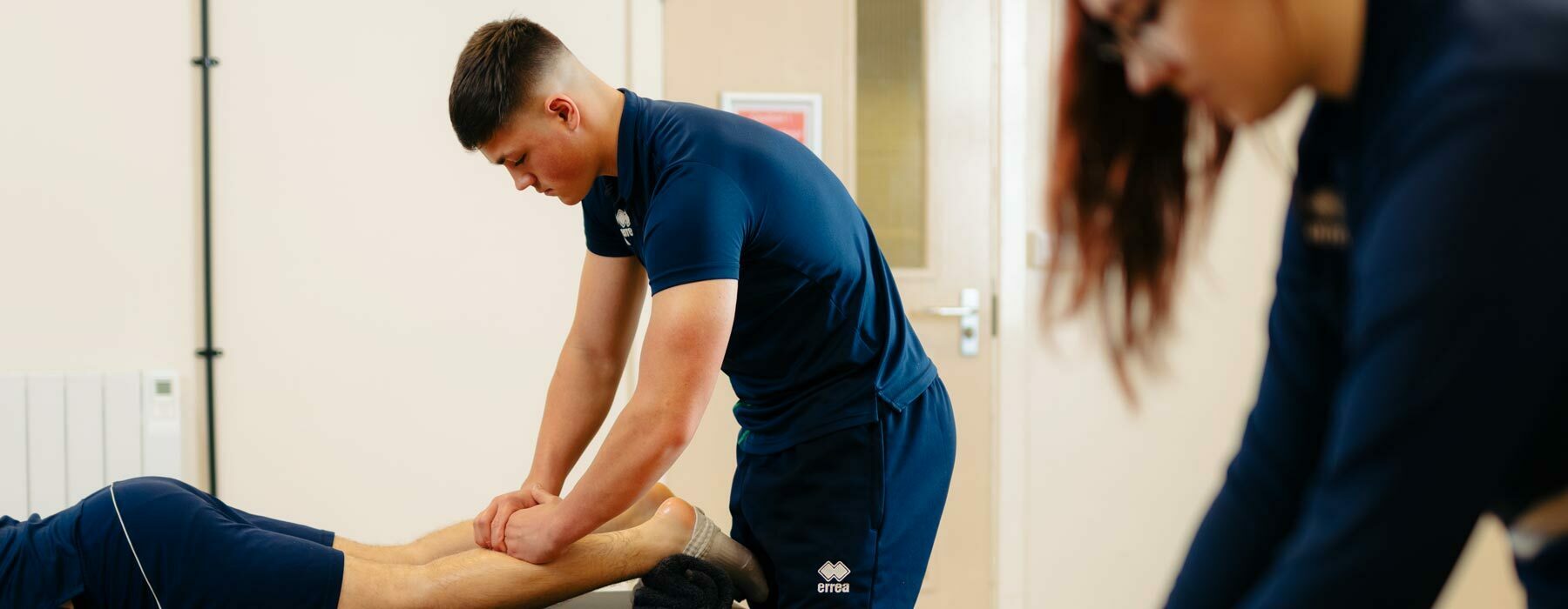 Sport banner Degree students developing sports massage techniques