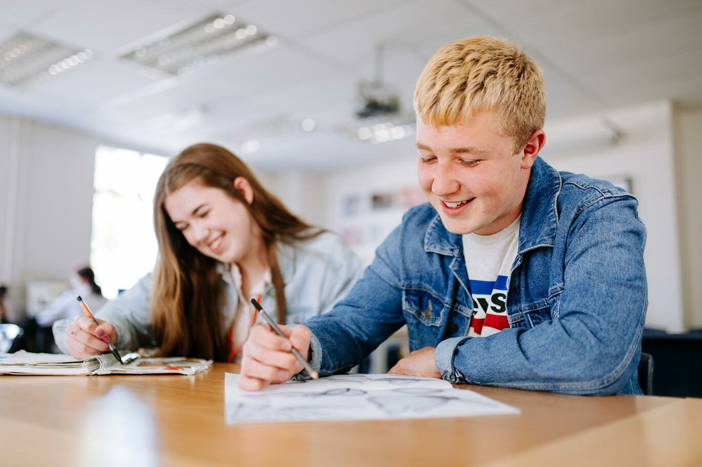 Students drawing in design studio