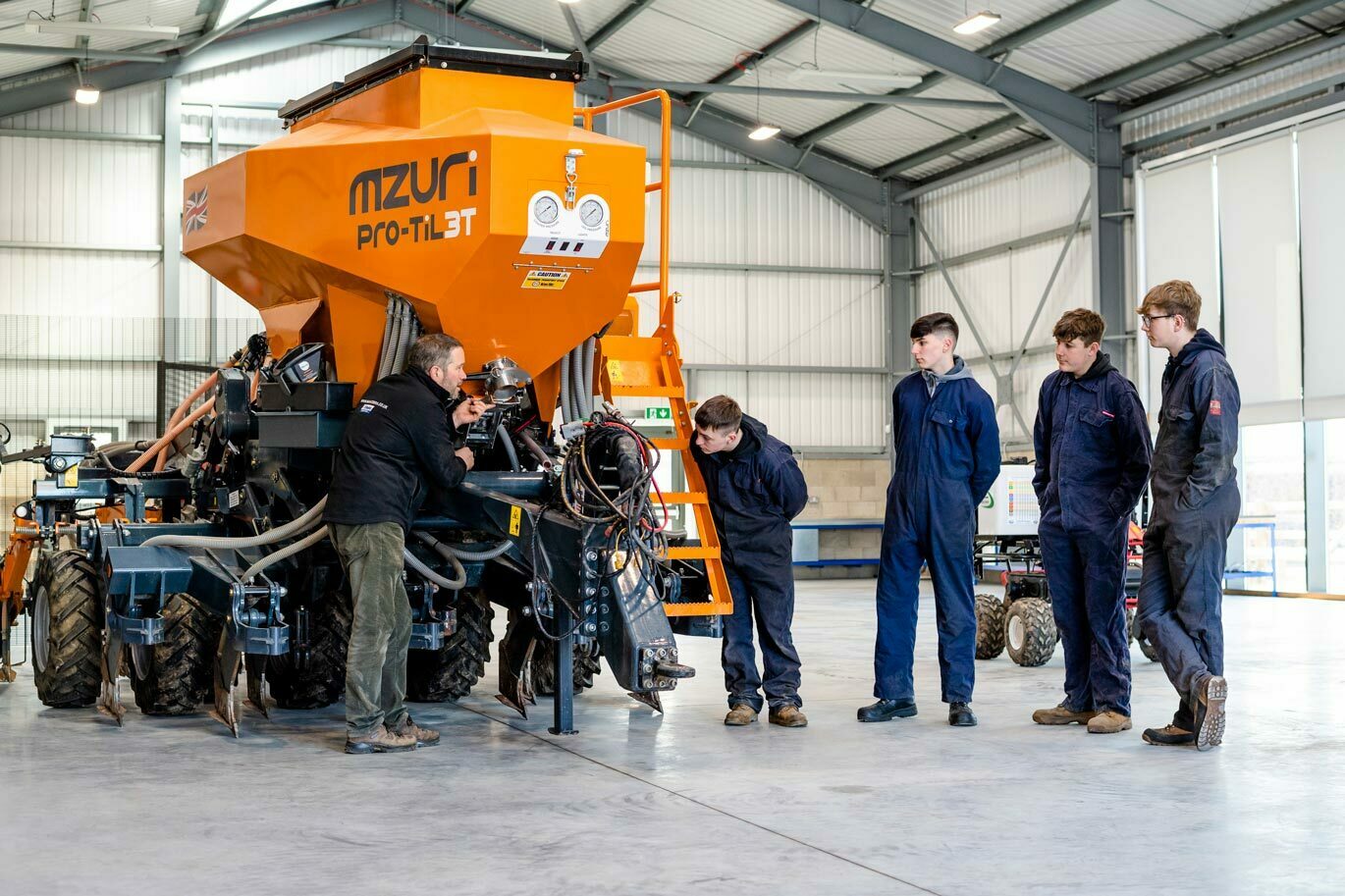 Students working with mzuri drill in Centre for Precision Agriculture