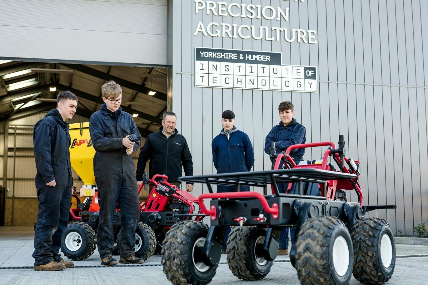 Teacher callout Engineering students driving robotic fertiliser