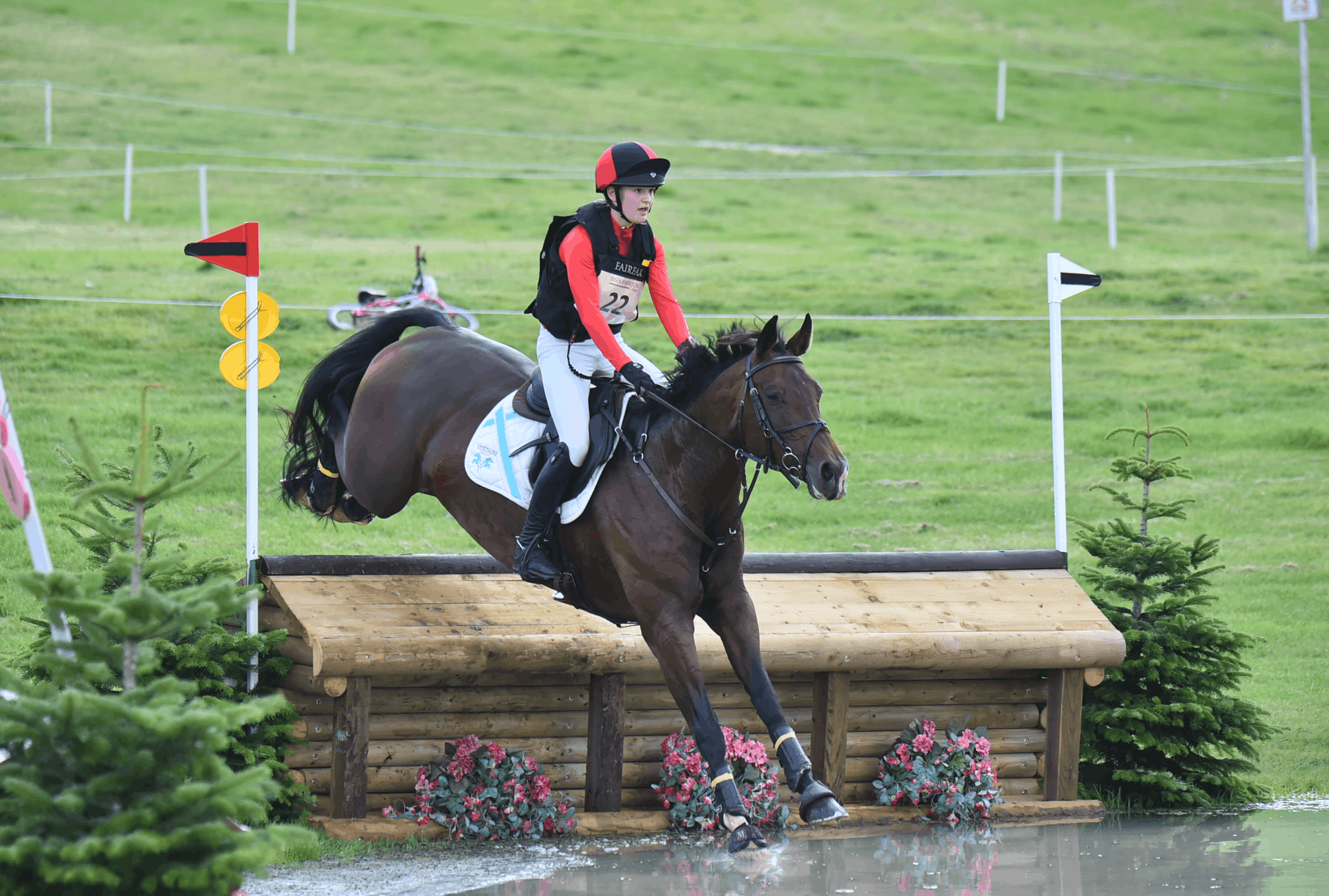 Young person jumping on a horse