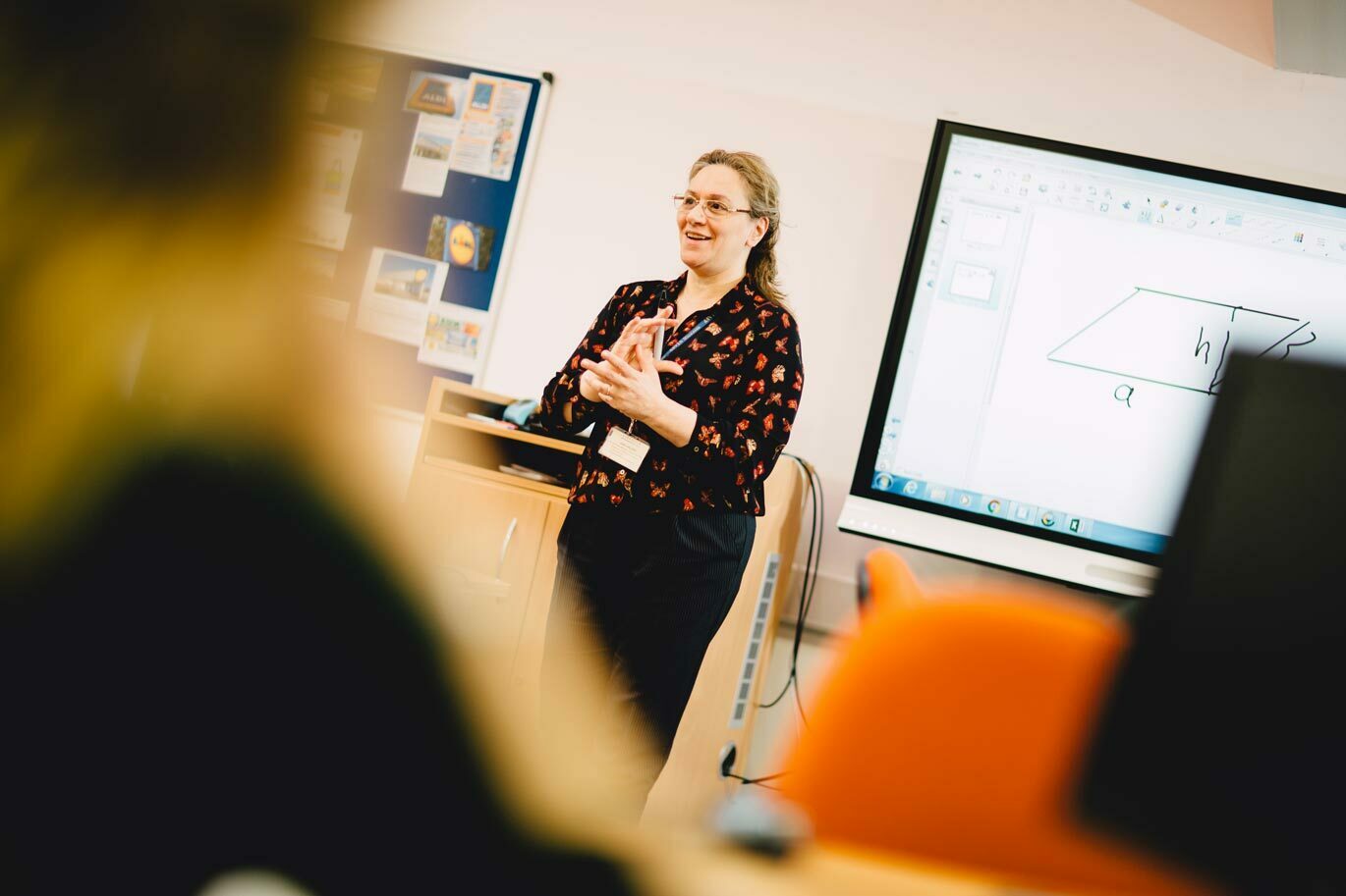 Teacher gallery Maths teacher presenting to class